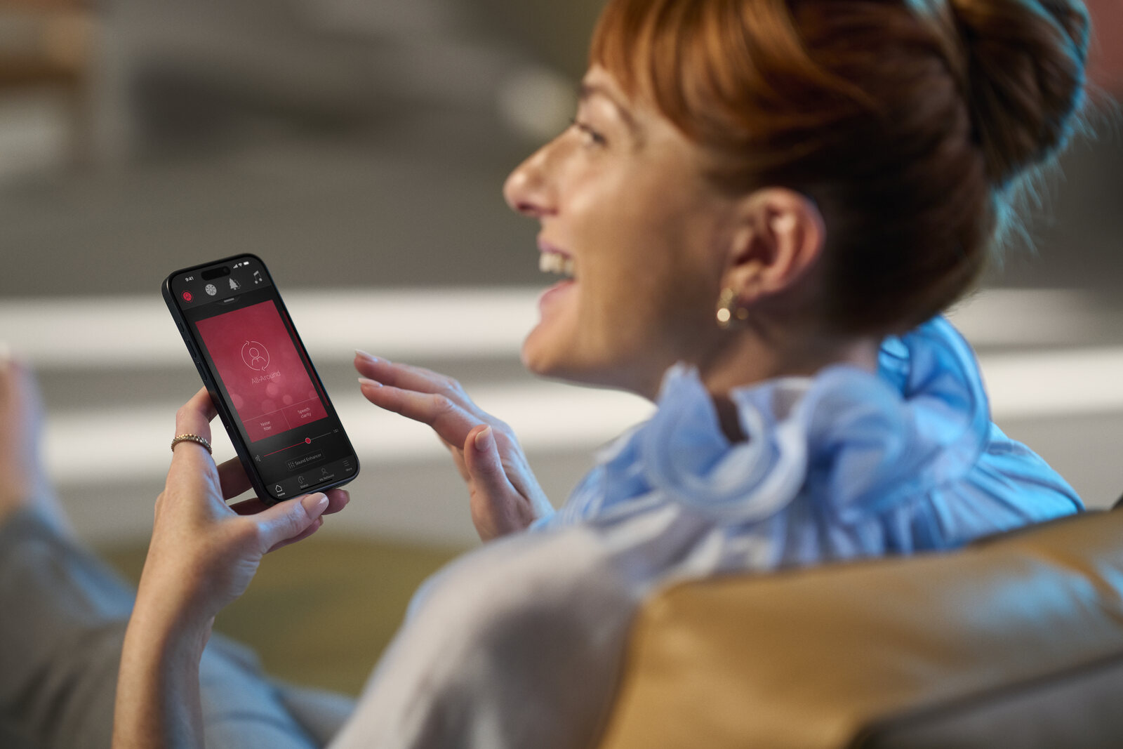A woman using the ReSound Smart 3D app